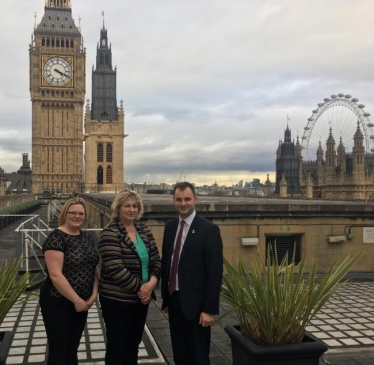 Luke with the Rose and Crown owners on the roof of Parliament